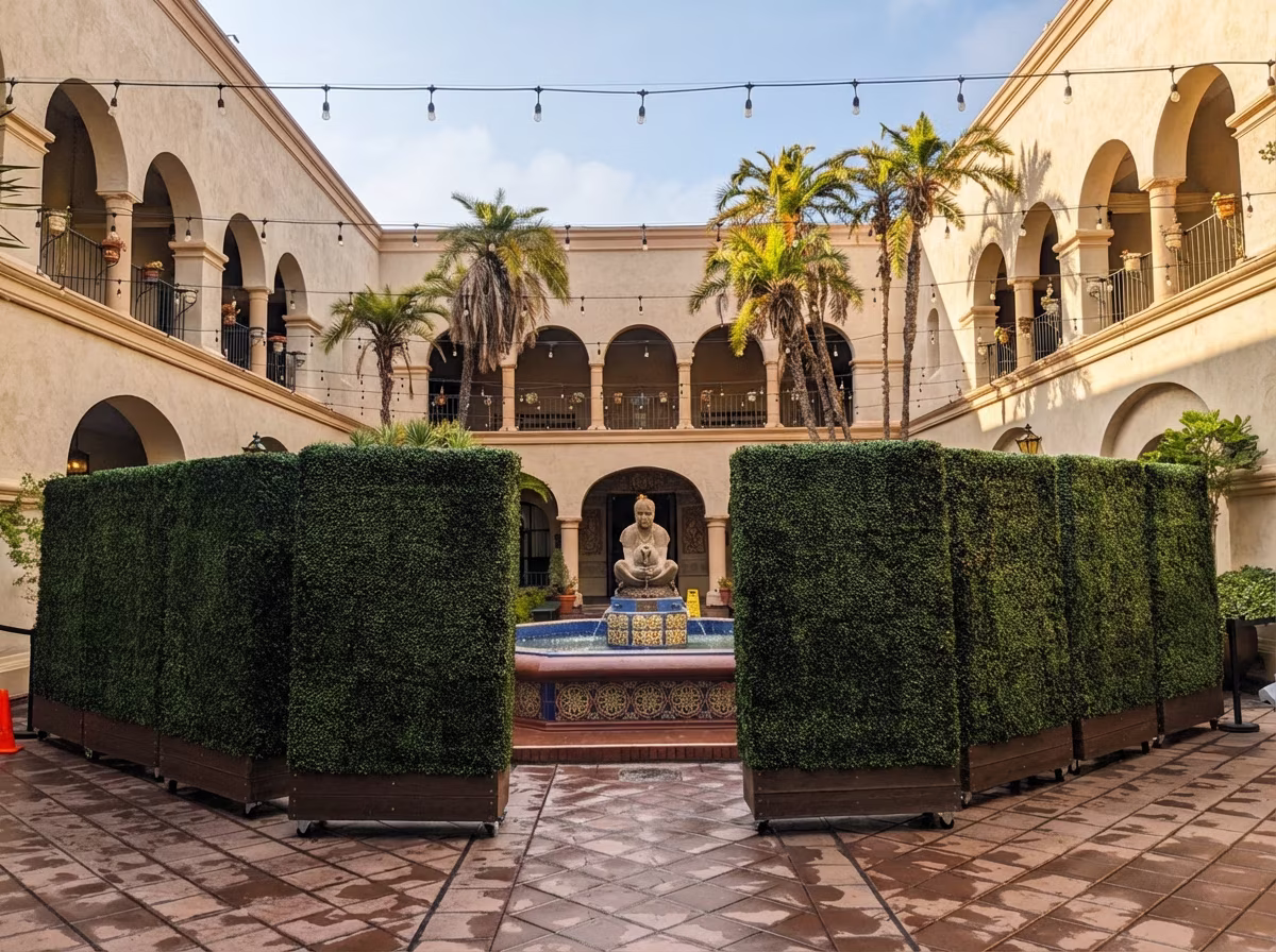 Modular hedge panels creating intimate dining spaces